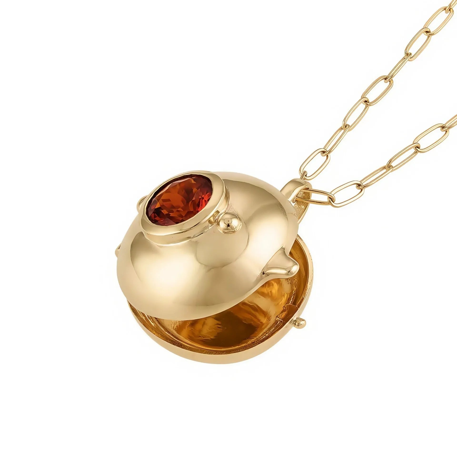 Gold-plated copper teapot pendant necklace with round red gemstone accent on regular chain, opened to show storage compartment