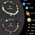 Two natural stone beaded bracelets showing different zodiac sign designs on a neutral background.