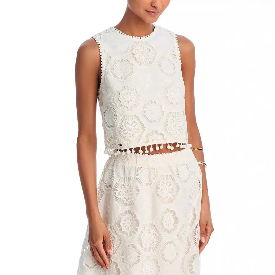 White women's retro style sleeveless top and long skirt suit set with embroidery detail.