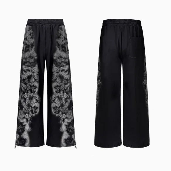 Loose-fit printed polyester streetwear co-ord set showing trousers, seven-inch shorts, and a hoodie on a hanger.