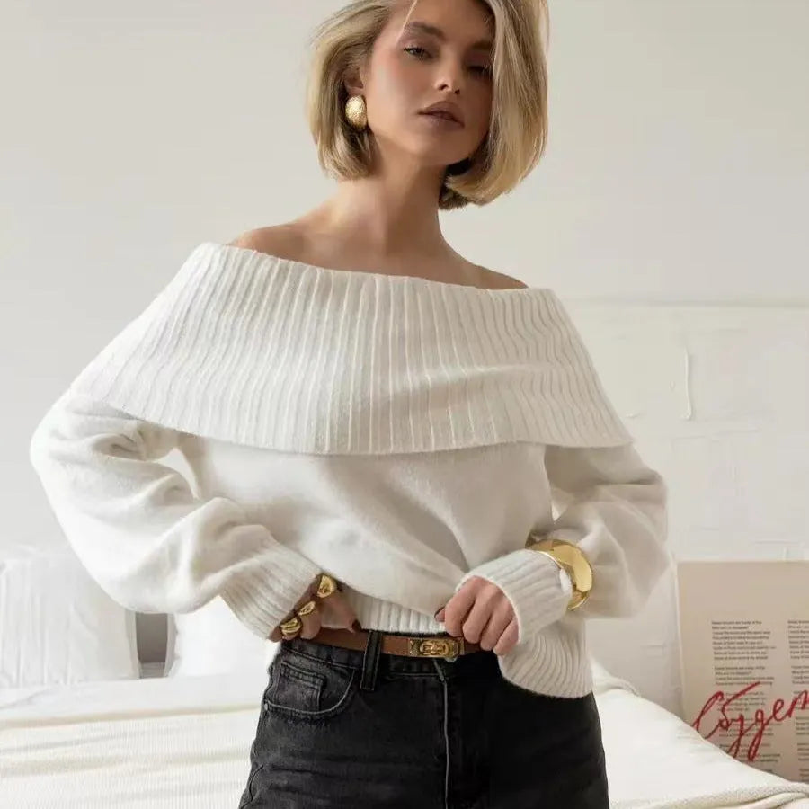 Grey strapless off-the-shoulder sweater with a 3D pattern on a mannequin.