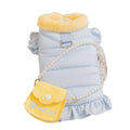 Small dog wearing a pink gingham princess skirt with built-in D-ring for leash attachment