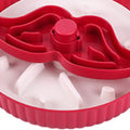 A rotating plastic pet feeding game board with an anti-choke pad and a detachable silicone licking mat in a windmill pattern.