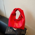 Women's casual PU leather foldable dumpling handbag in multiple colours showing sandwich pocket.