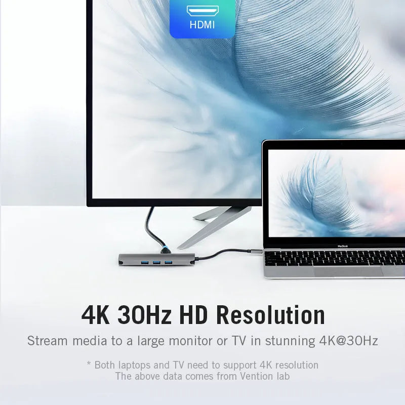Deep grey Type-C to HDMI USB3.0 Ethernet adapter hub with SD and TF card slots on a desk.