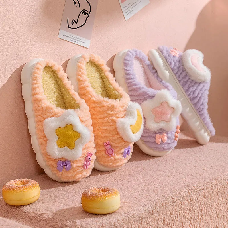 Women's light blue fleece-lined plush home slippers with round heel and PVC sole.