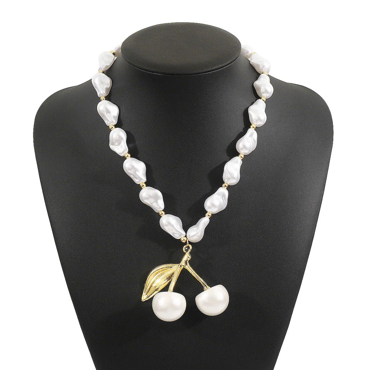 Gold and pearl fruit geometric necklace for women on a white background