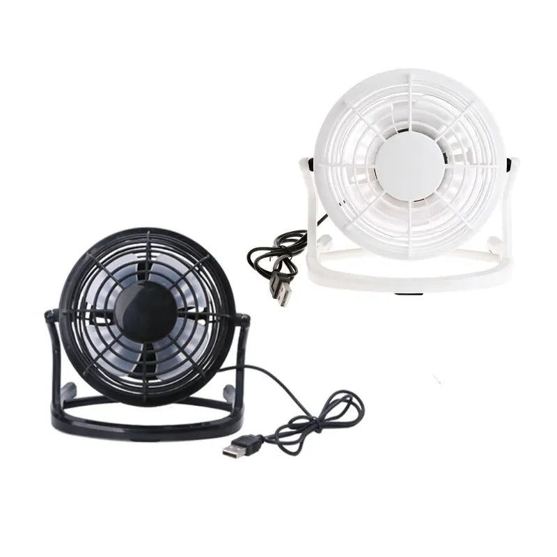 Small black adjustable USB desk fan with key switch on a wooden table.