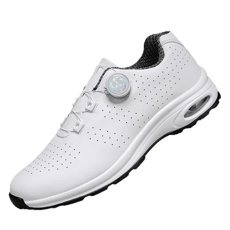 Pair of black low-top mesh tennis shoes with cross shoulder straps and white laces.