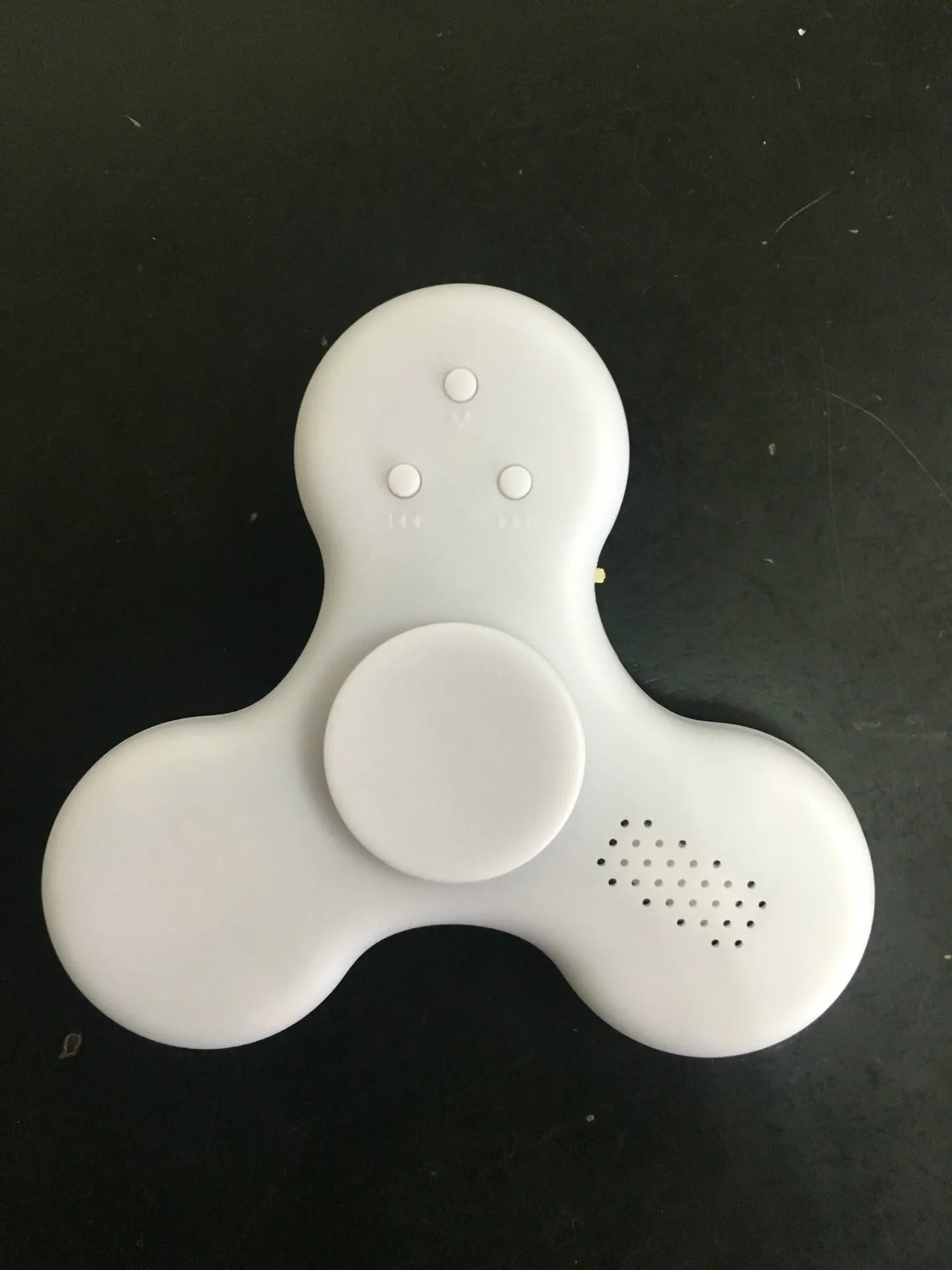Square white Bluetooth speaker and fidget spinner toy with control buttons, measuring 80mm.