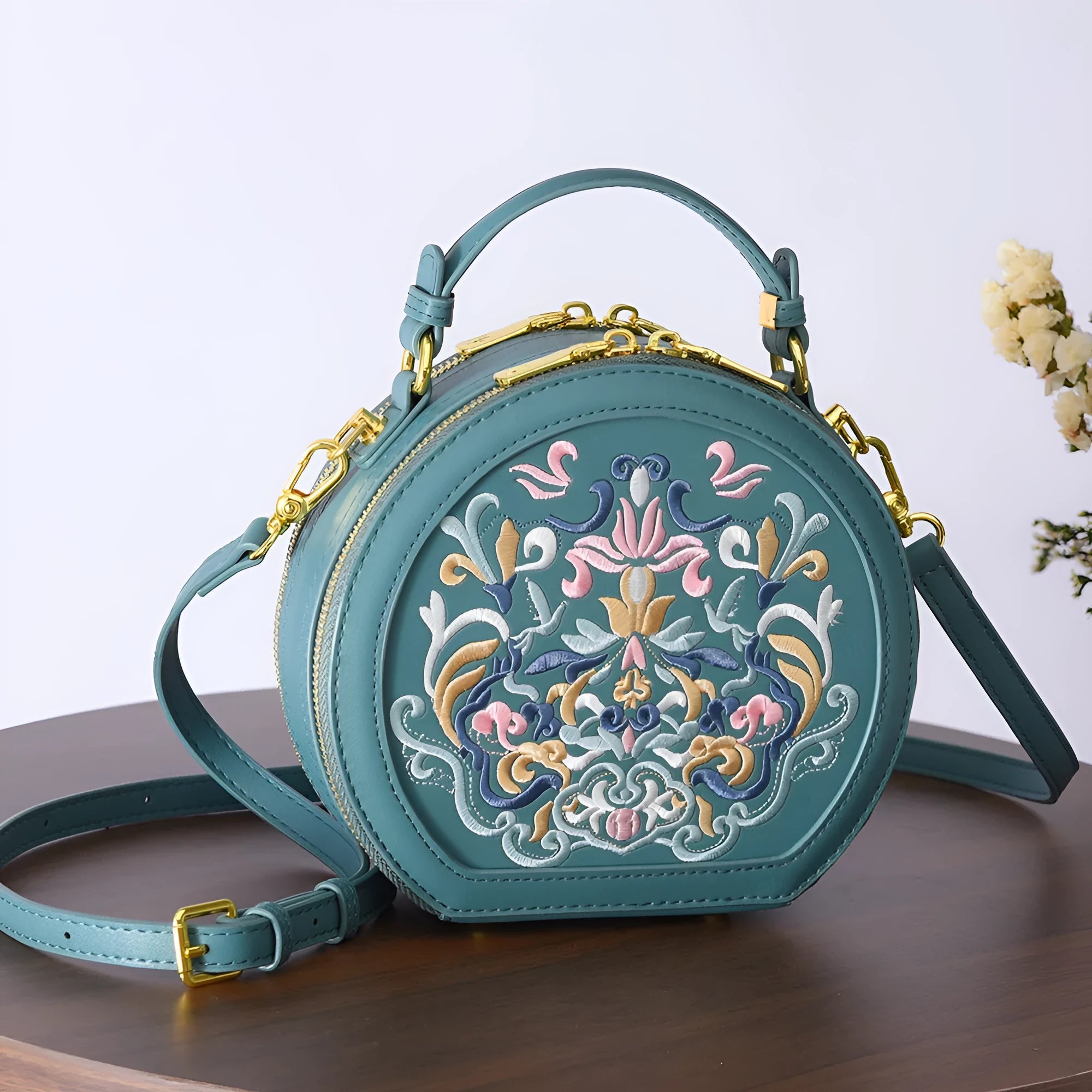 Round PU leather crossbody bag with embroidery and sewing line, available in five colours