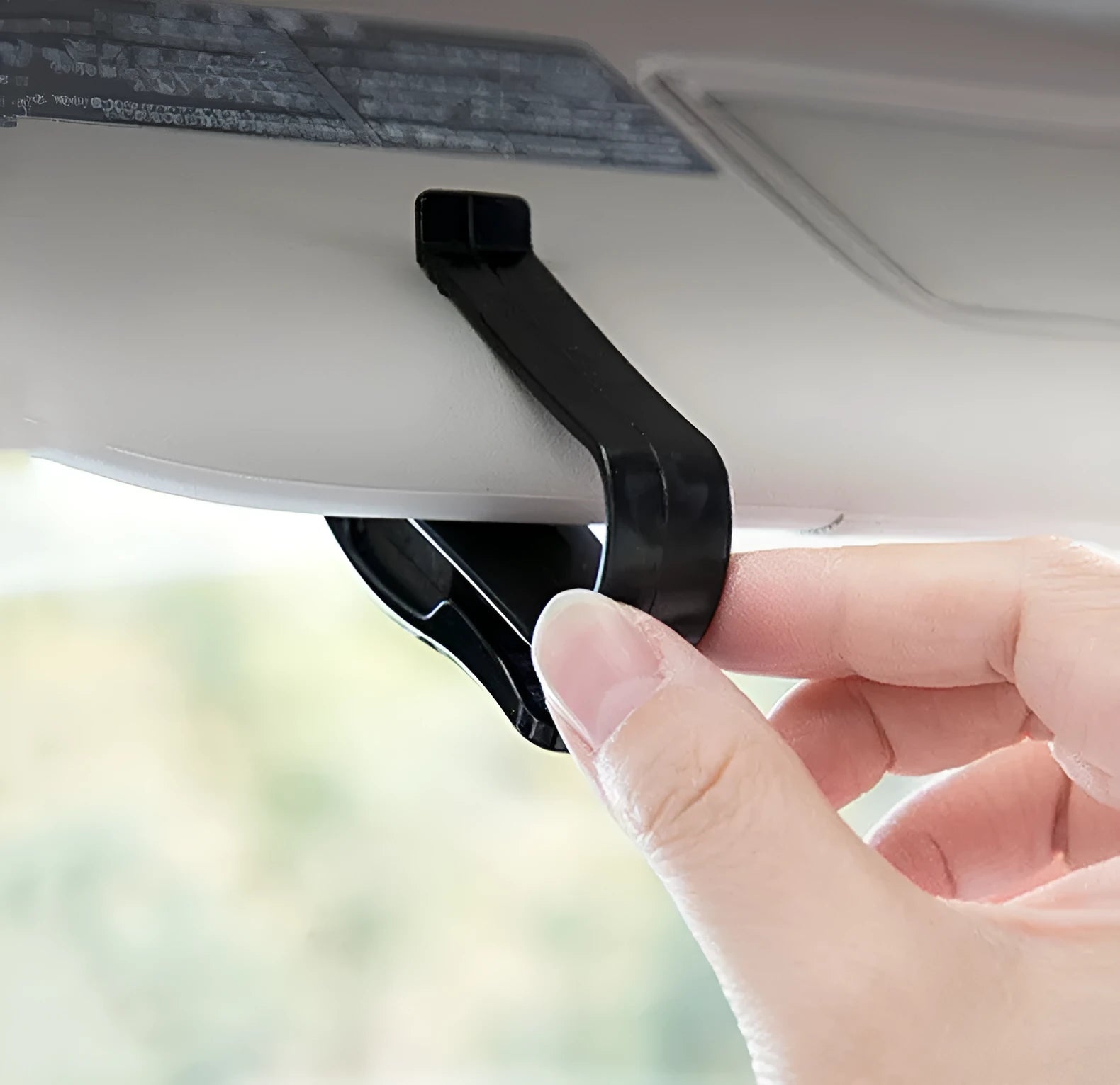 Black plastic car sunshade clip for holding glasses and ID cards, shown next to a ruler showing 6.5cm length.