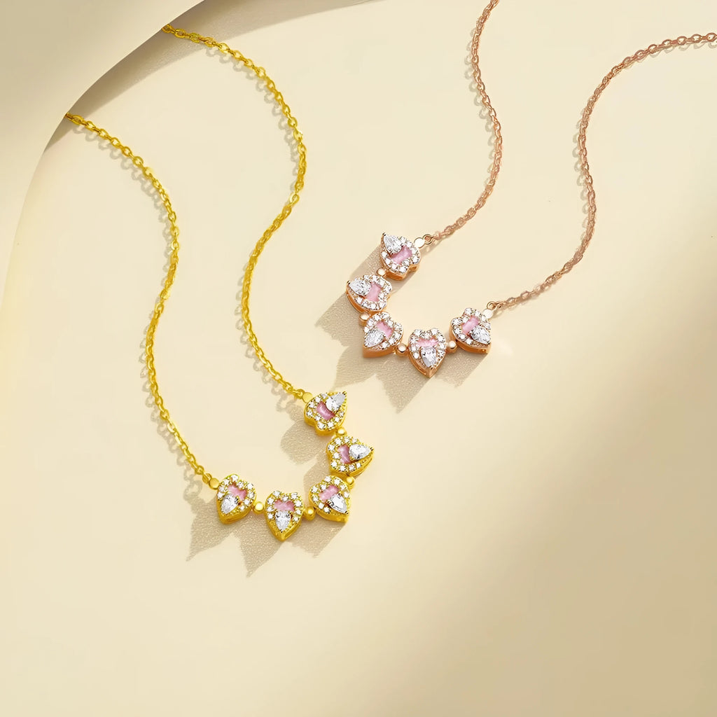 Dual-wear summer mori necklace with copper heart pendant and flower elements in gold colour on woman