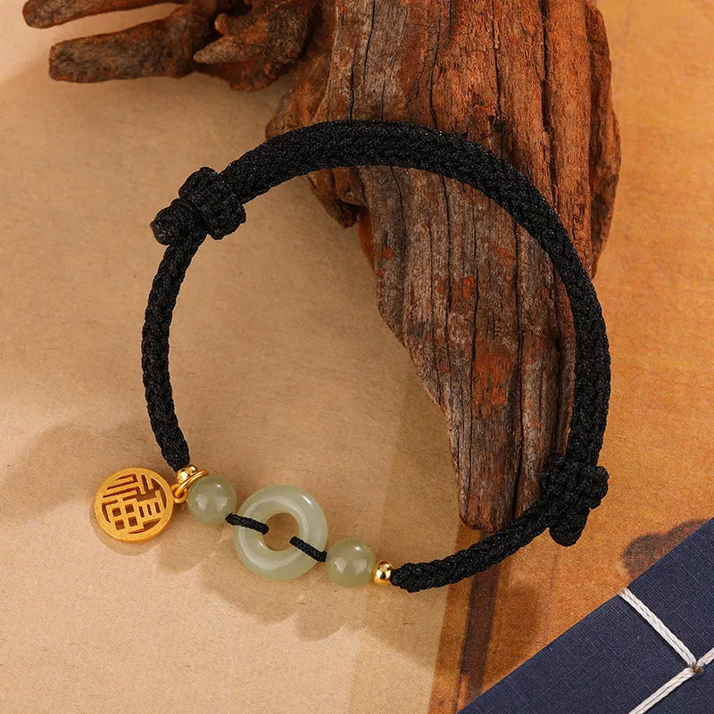 Silver geometric bracelet with peace buckle and integrated carrying strap in black colour
