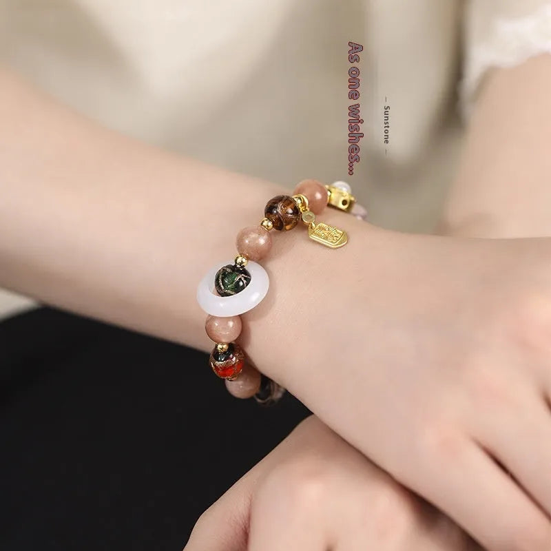 Hand-woven women's bracelet with fragrant grey coloured glaze and round beads