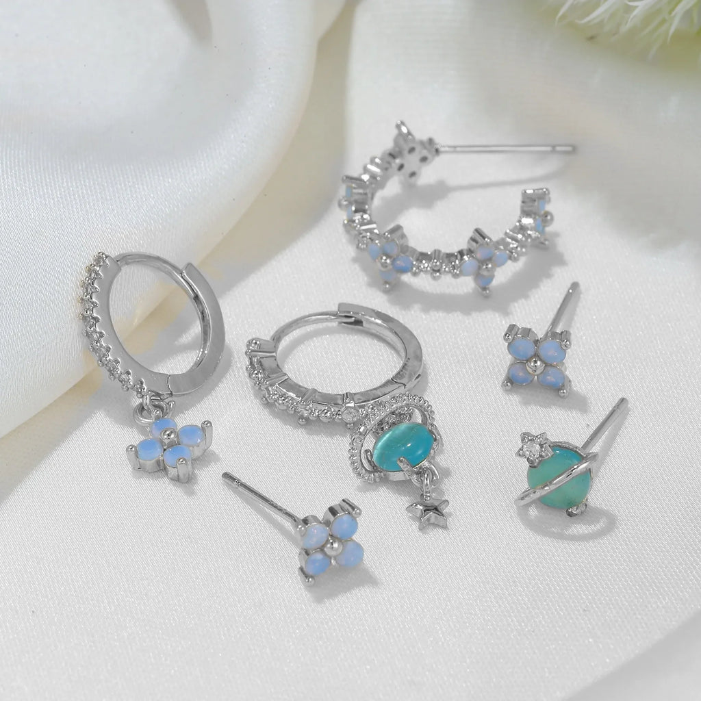 Gold and silver floral stud earrings with zircon detail in a Japanese Korean sweet girl style.