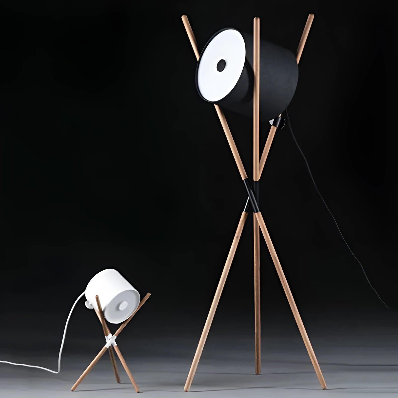 Modern three fork wooden floor lamp with an acrylic shade in a living room setting.