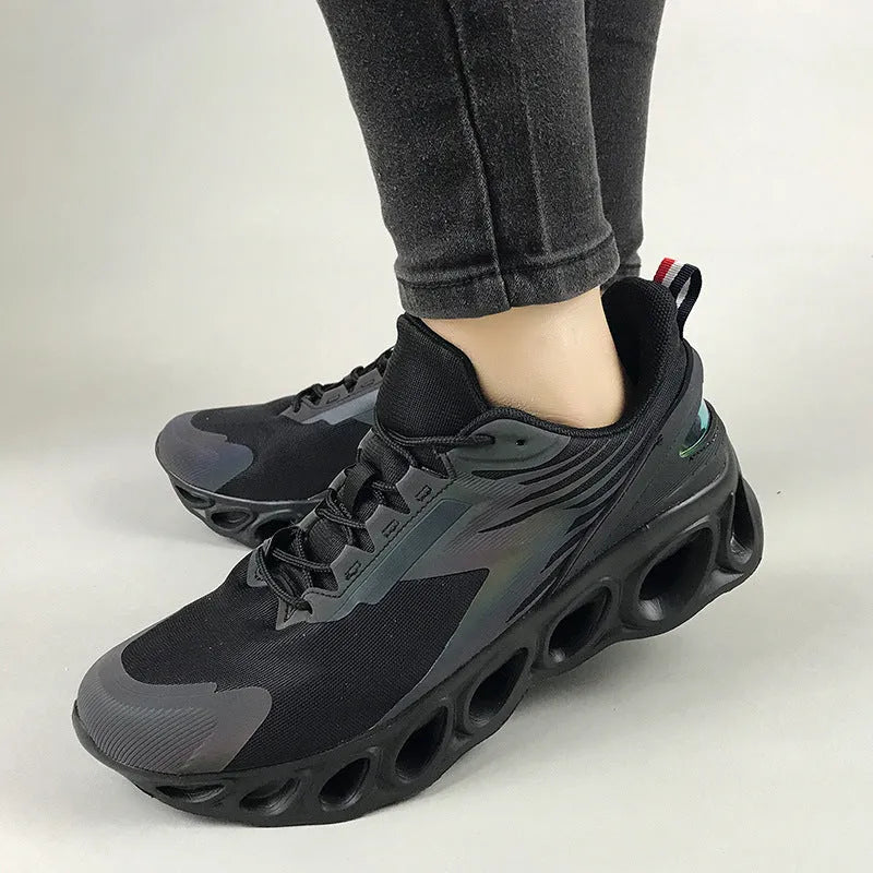Breathable mesh men's casual sports shoes in black with white laces and a low-top EVA sole design.