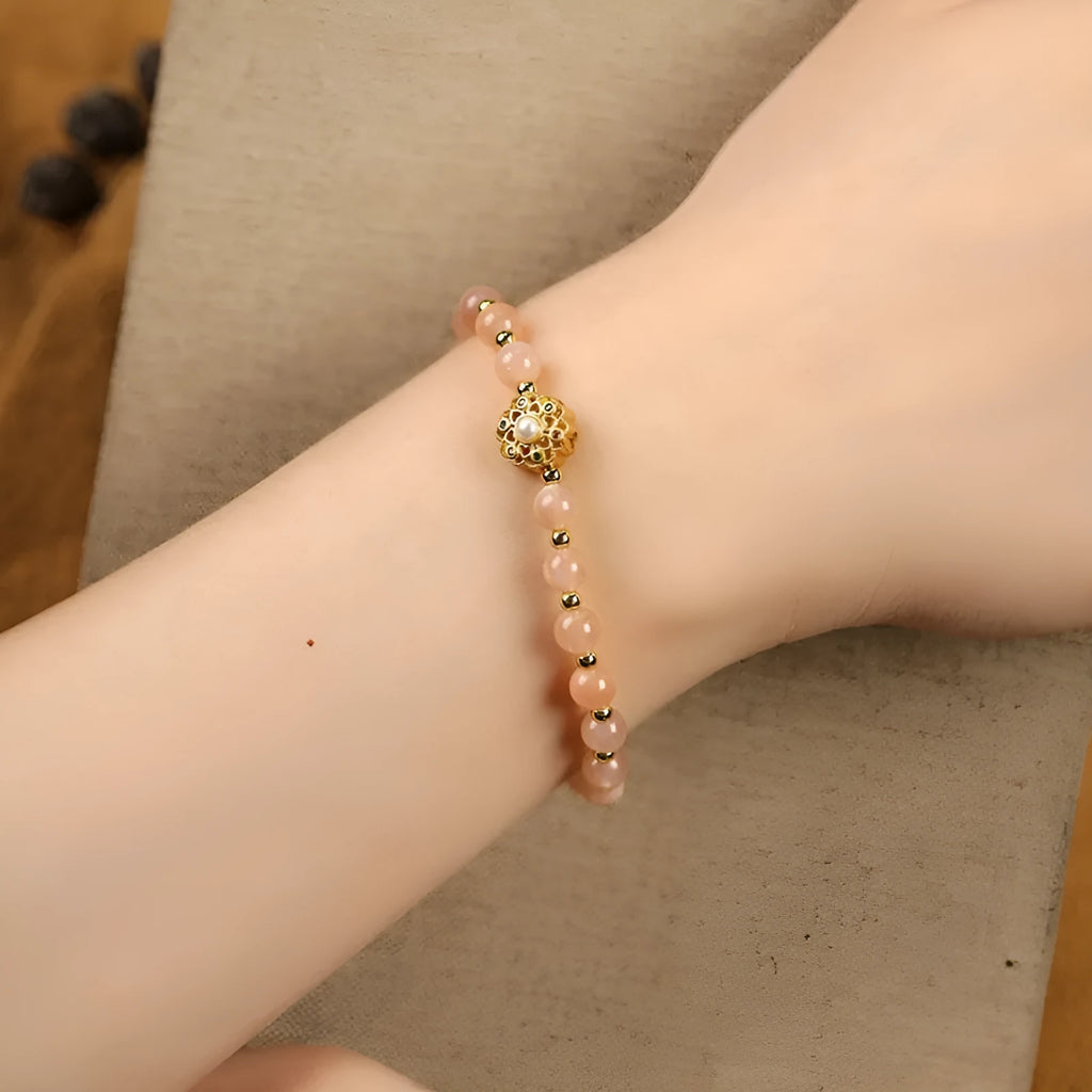 Hand-woven gray moonstone crystal bracelet with pink sunstone and peach strawberry quartz beads