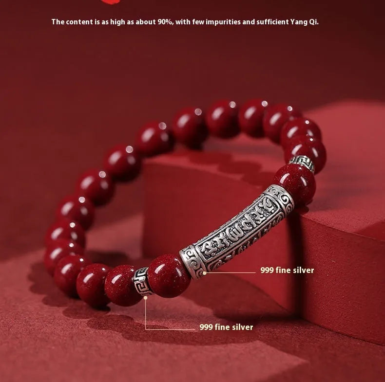 Handmade cinnabar sandstone bracelet in purple gold sand colour with 8mm beads on a wrist.