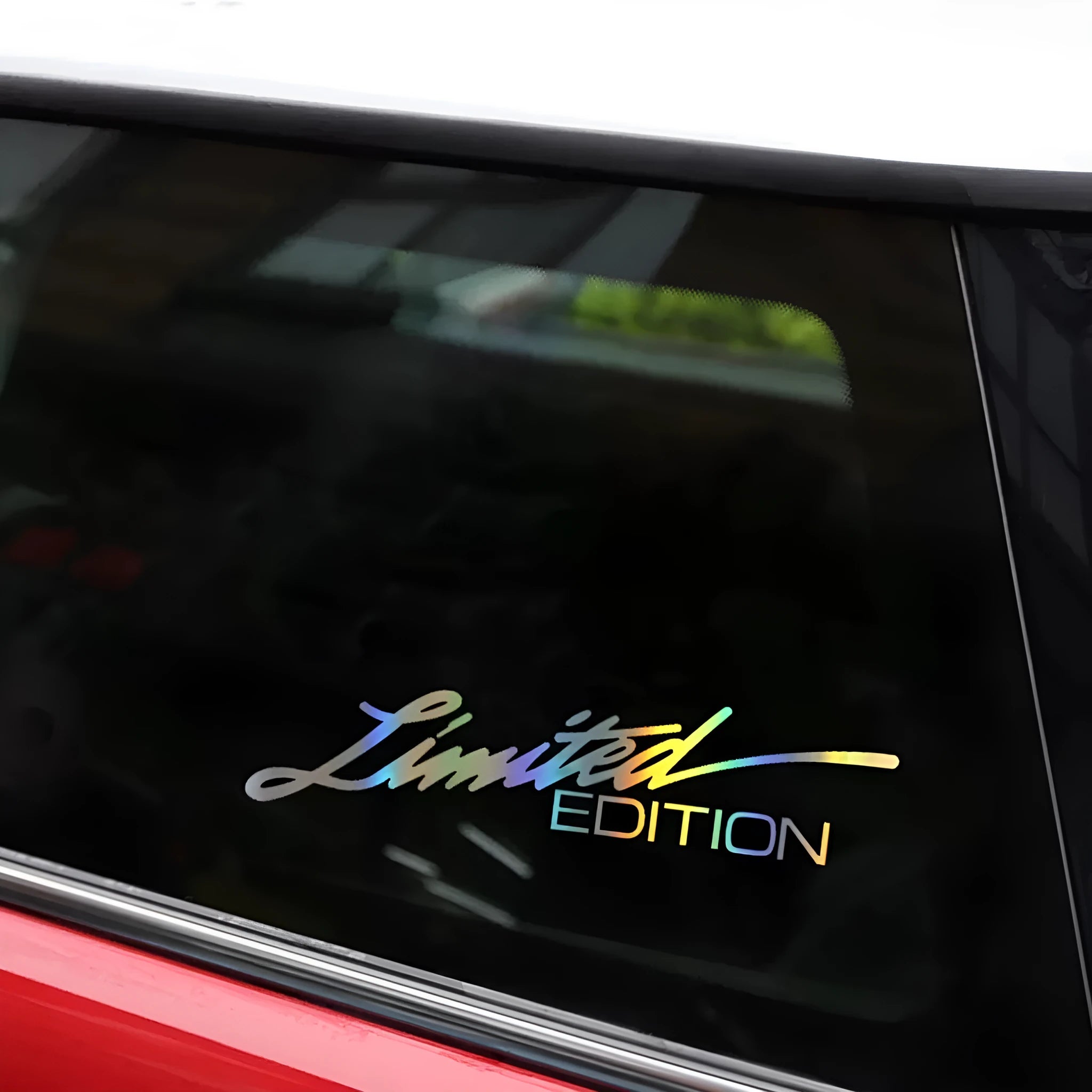 Black reflective laser-cut car sticker on vehicle window