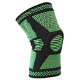 Blue sports knee pad with a visible silicone spring circle on a polyamide sleeve.