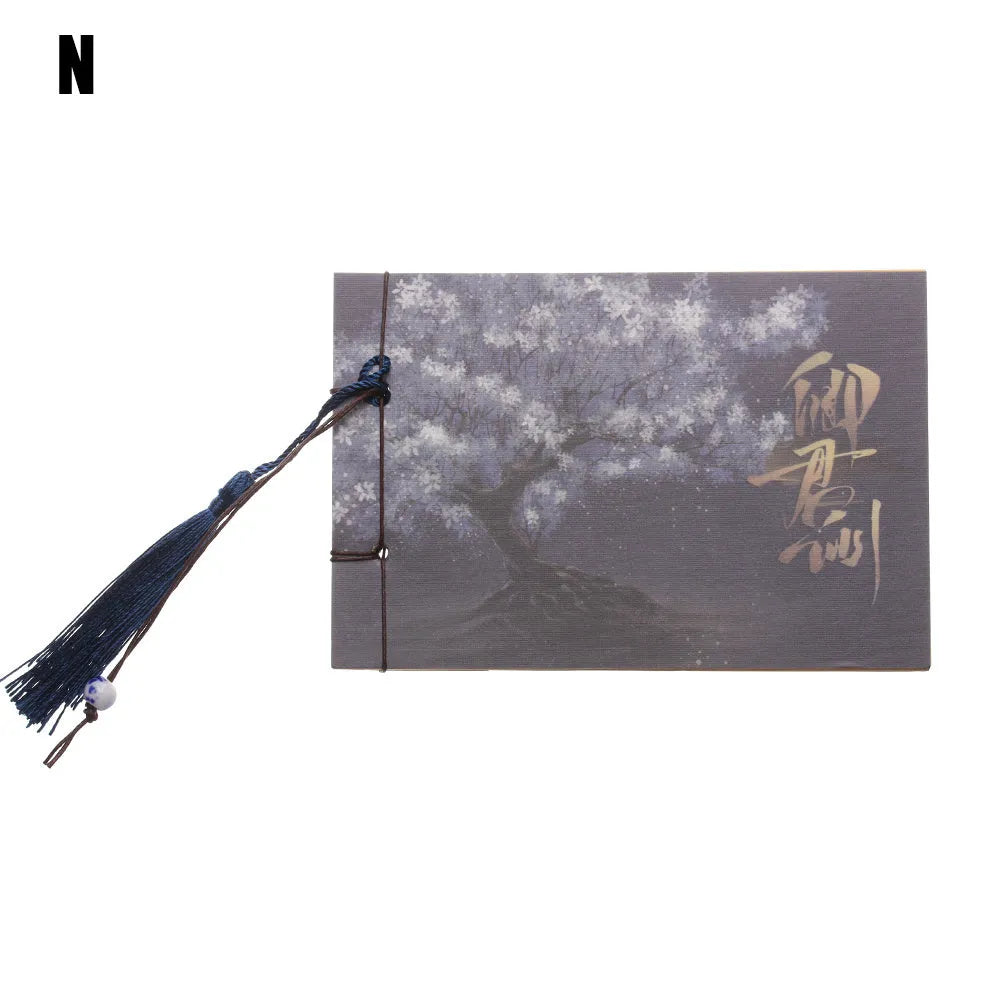 A5 kraft paper notebook with a hand-stitched binding and a hanging tassel bookmark in a natural design.