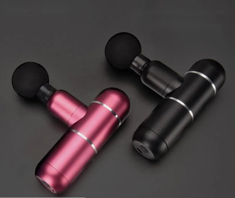 Mini fascia gun massage gun in black with four massage heads, 580g body, and USB charging cable