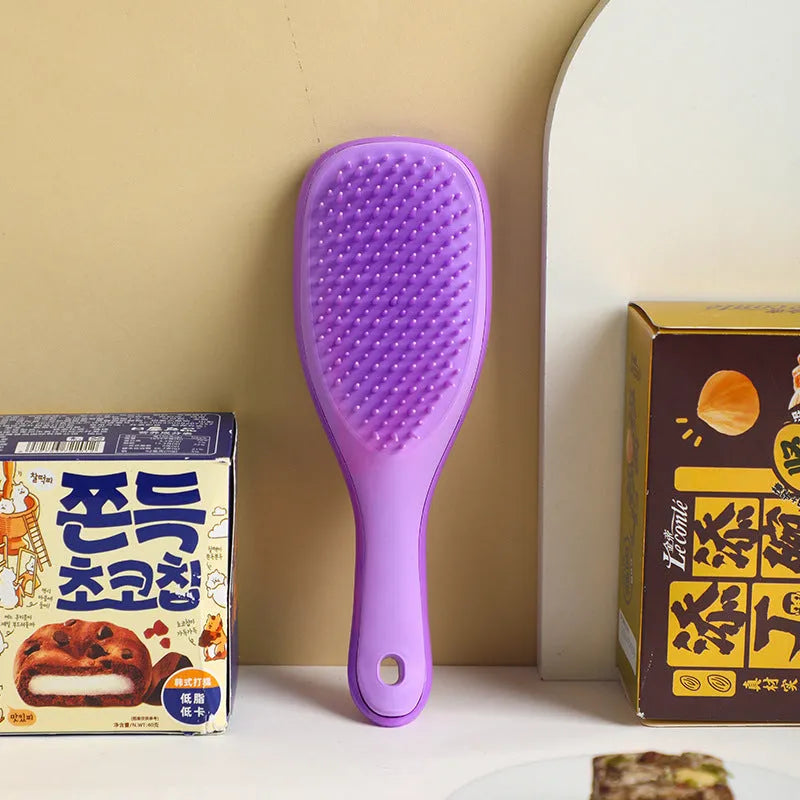 TT Air Curling Massage Home Princess Comb in pink, a plastic air-cushion hairbrush with massage tips