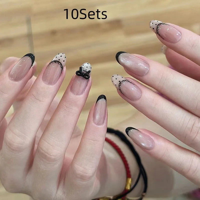 Pink artificial false nails with sweet girl illustrations, sold in sets of 5, 10, or 15.