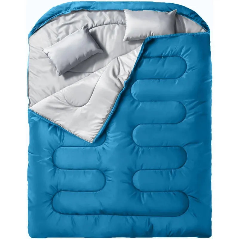 Portable pillow size polyester sleeping bag in black double colour, folded compact