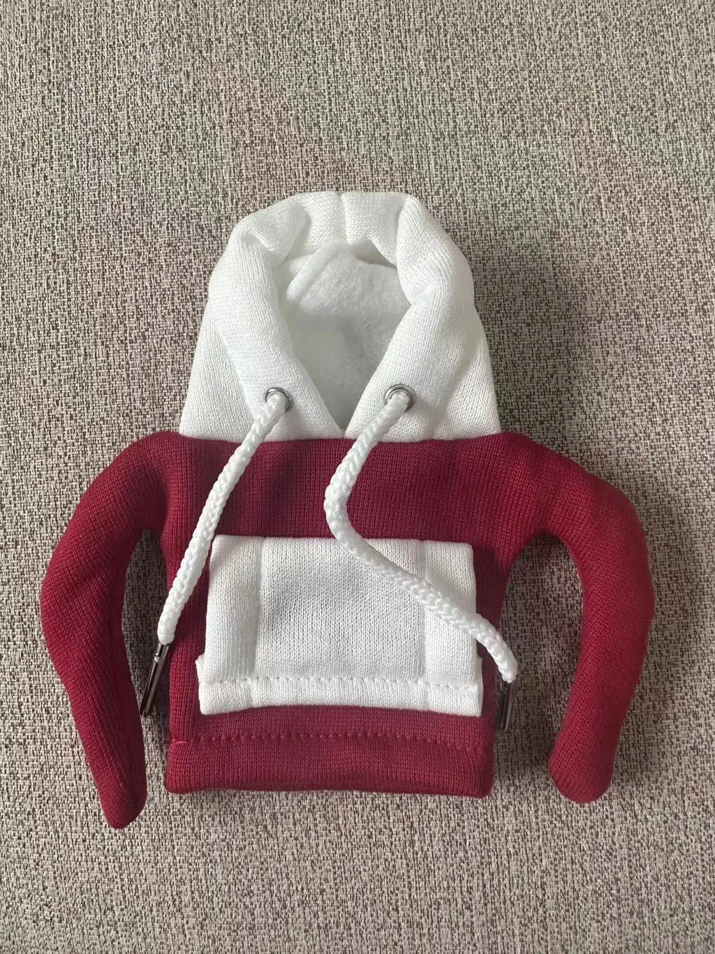 Polyester knit hood cover for car gear lever in red and white colour combination.