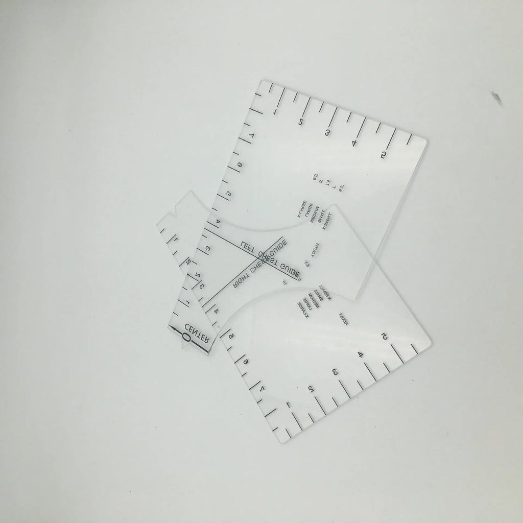 Clear acrylic sewing patch ruler for T-shirt alignment, 10 by 6 inches.