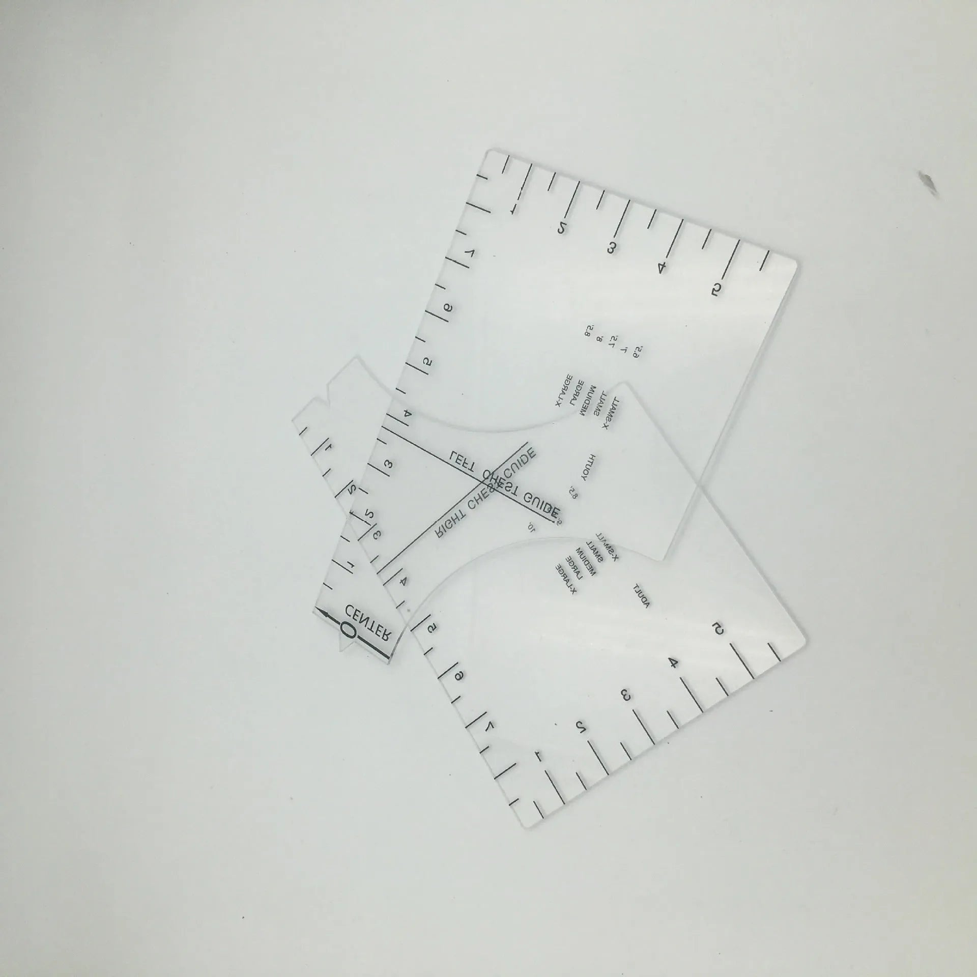 Clear acrylic sewing patch ruler for T-shirt alignment, 10 by 6 inches.