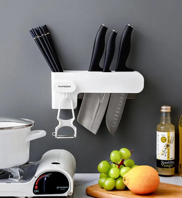 White plastic kitchen knife rack on countertop with dimensions 26 cm height