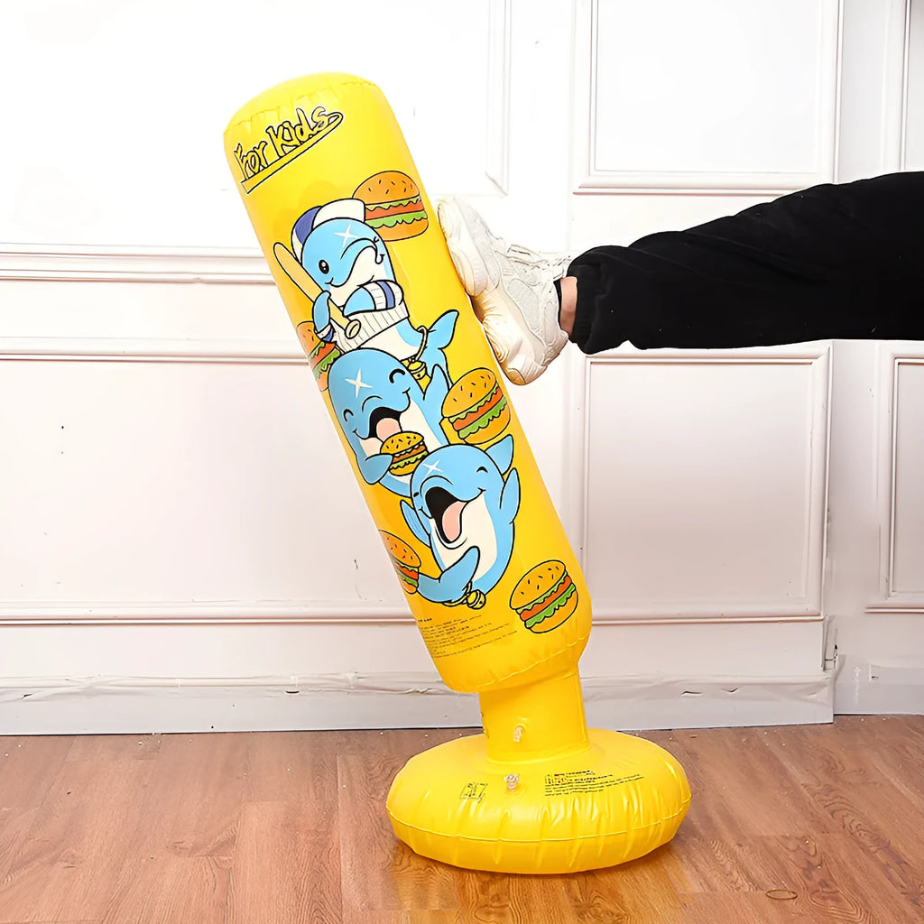Tall yellow inflatable boxing column standing upright on a floor.