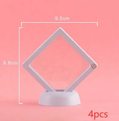 3D floating display case holding coins and jewellery between transparent membrane sheets