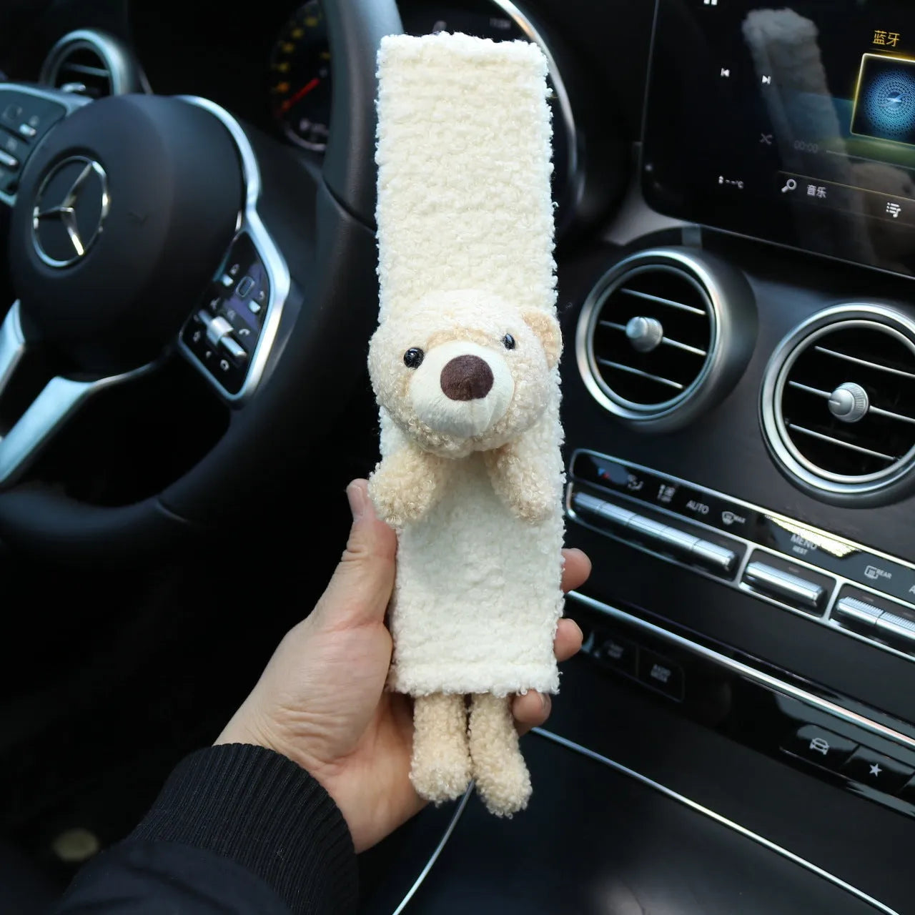 Cartoon rabbit and bear designs on a soft lamb wool car seatbelt shoulder protector.