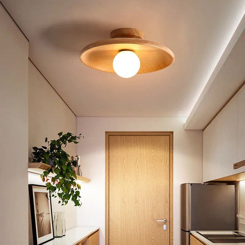 Modern minimalist ceiling lamp with solid wood body and glass shade in wood or walnut colour.