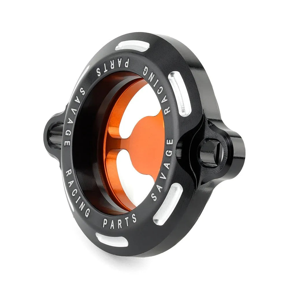 Aluminium alloy transparent oil filter cover for KTM DUKE motorcycles on a workbench