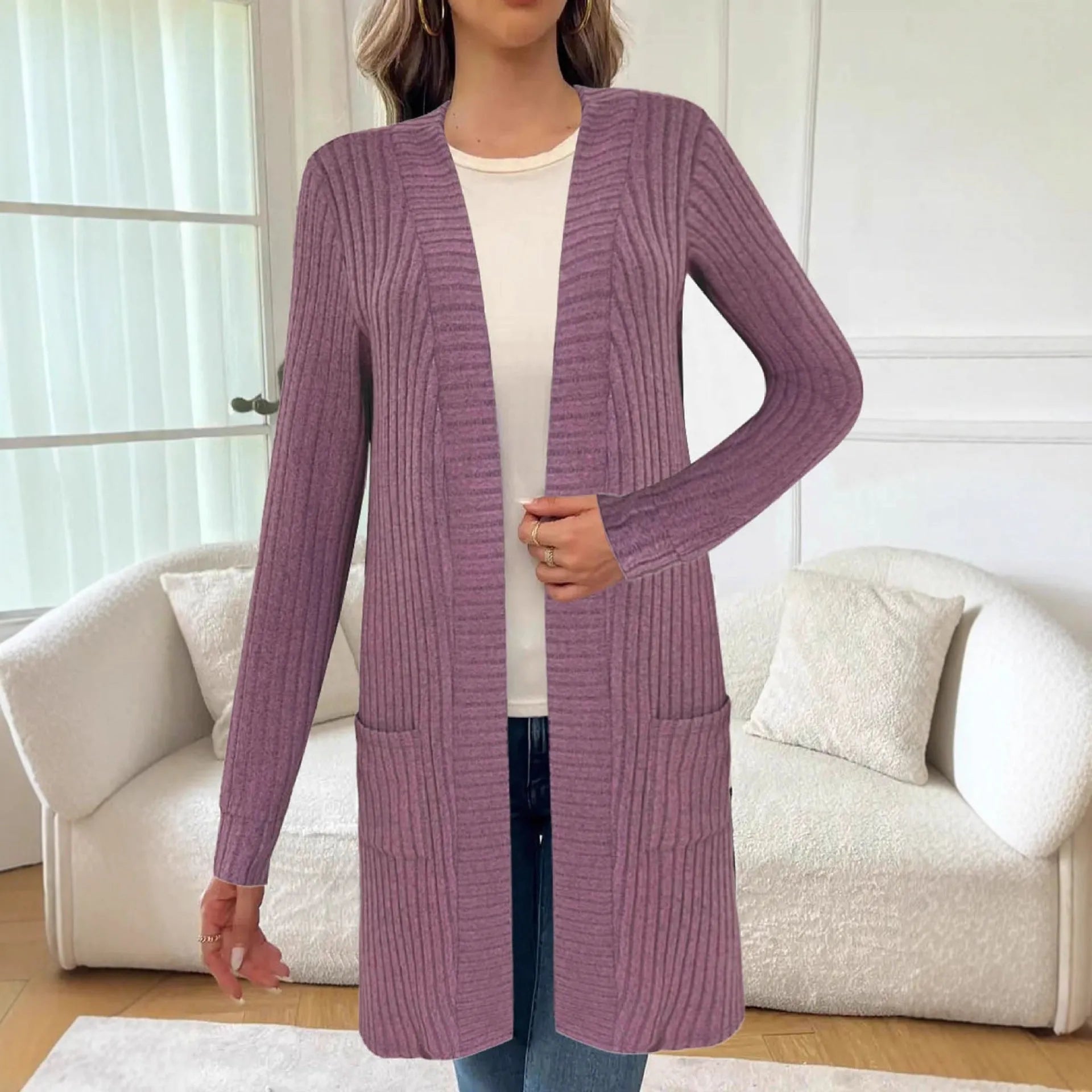 Women's plus size black knitted cardigan jacket with long sleeves and front pockets.