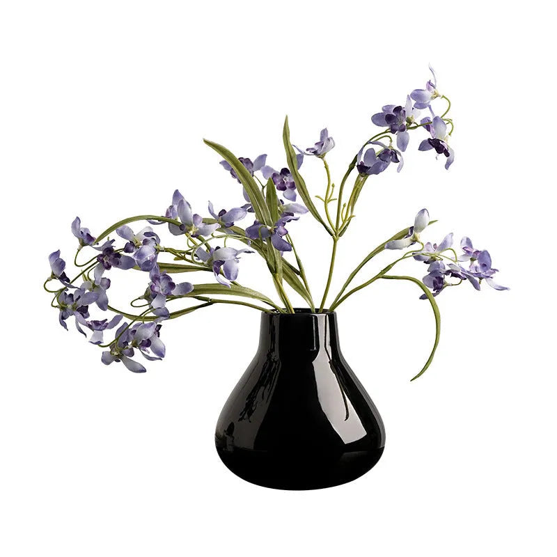 Ceramic round belly vase with black or white coloured glaze finish and modern simplicity design