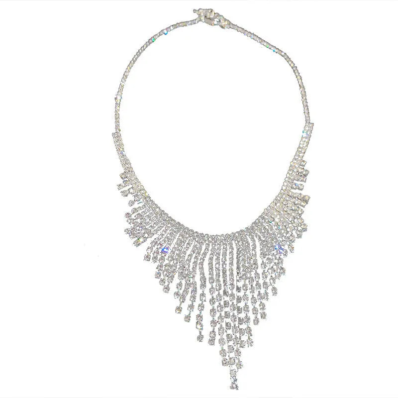 Silver alloy diamond tassel necklace with geometric pendant and ball bead chain on a woman