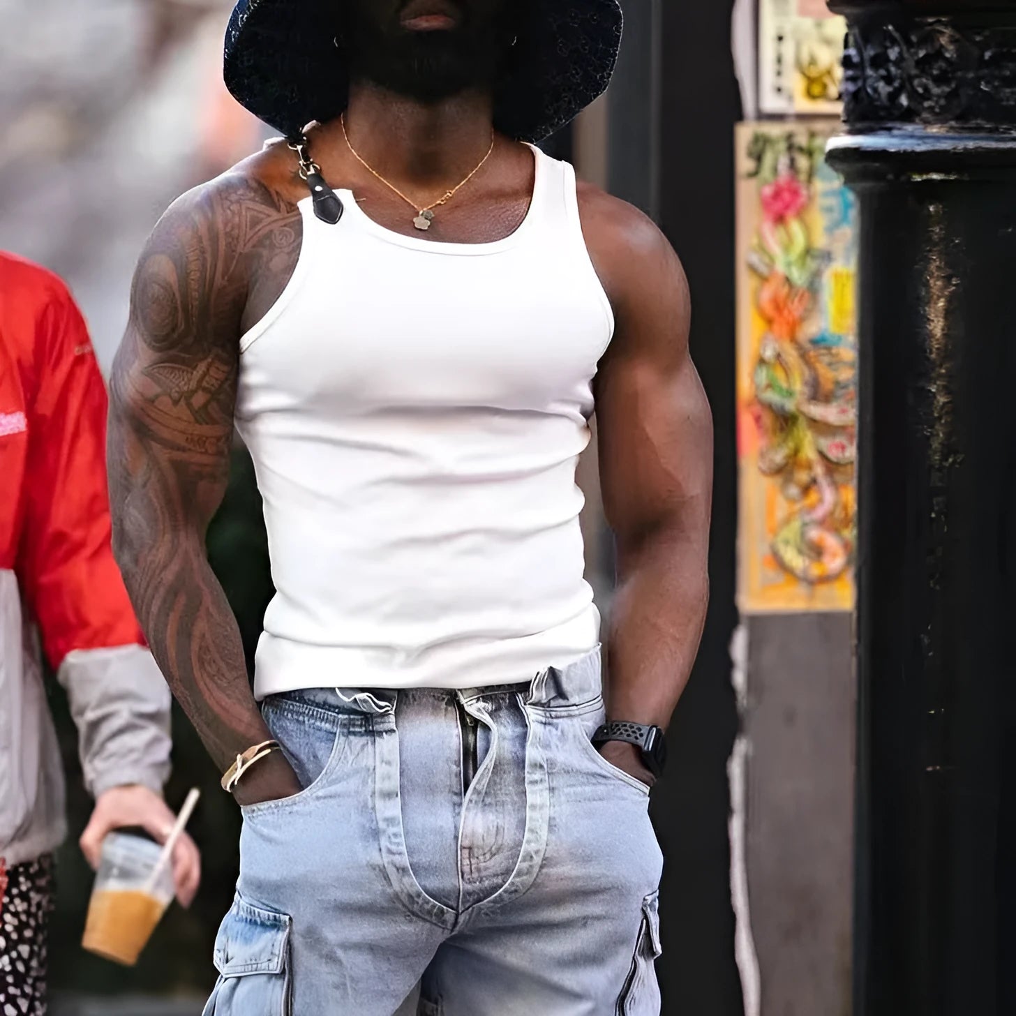 A tight-fitting sleeveless vest in solid black or white, made from cotton blend fabric.