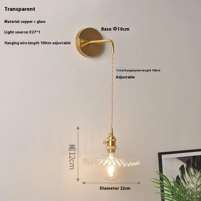 Retro copper wall lamp with a glass shade in a choice of six colours on a wall.