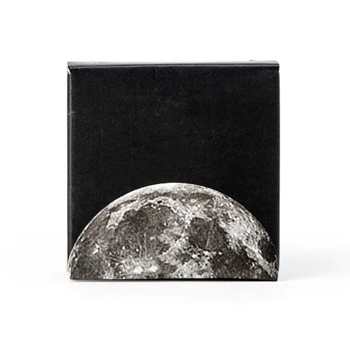 Box containing 45 black moon phase and planet calendar stickers on self-adhesive paper.
