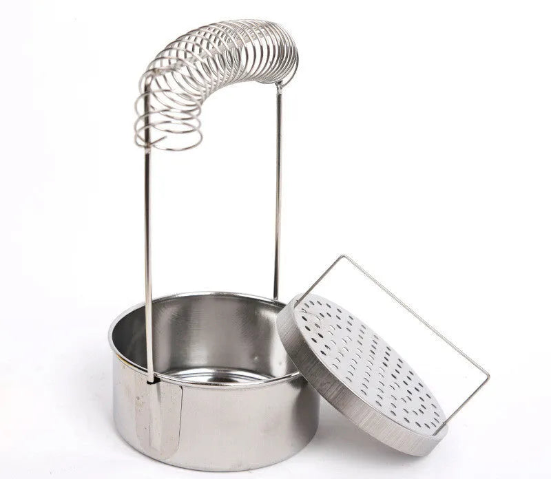 Silver stainless steel oil painting pen washer with a sprung metal clamp and leak plugs.