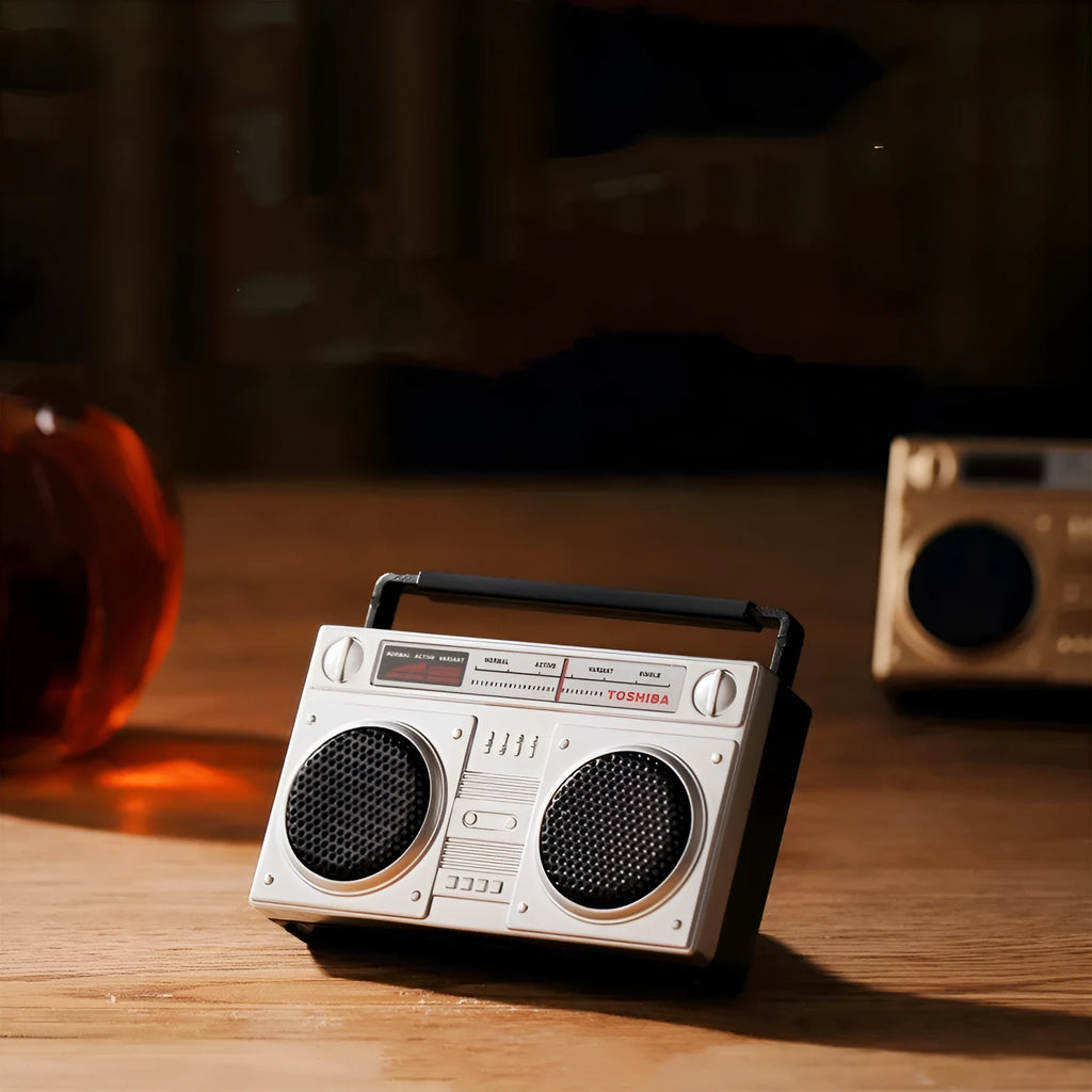 Gold retro cassette tape recorder car air freshener diffuser on a car vent.
