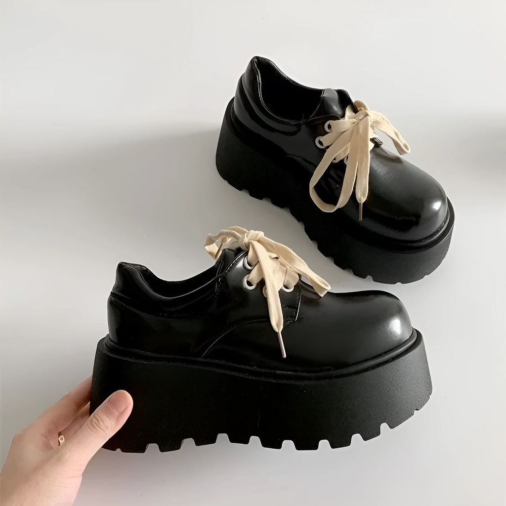 Matte black women's lace-up high-heel shoes with a thick sole and an English muffin heel.