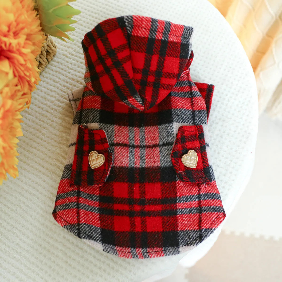 Red plaid dog trench coat shown alongside black houndstooth version, displaying five size options for pet clothing